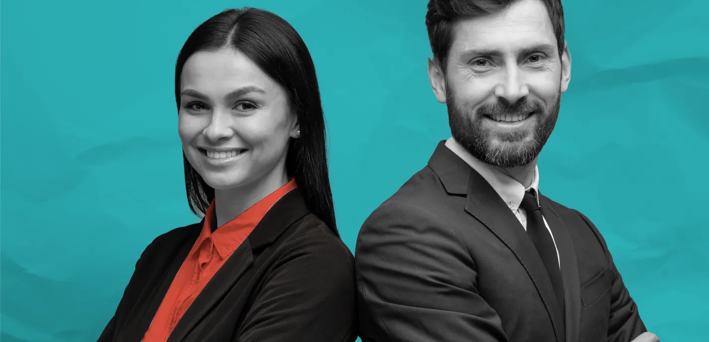 Young female and male attorney standing back to back smiling against teal background